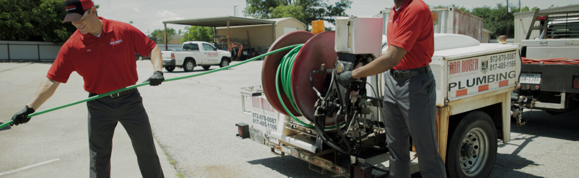 Two Plumbers Working Together Image