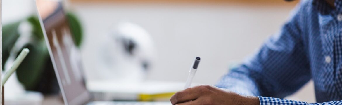 A Man Writing in a Diary