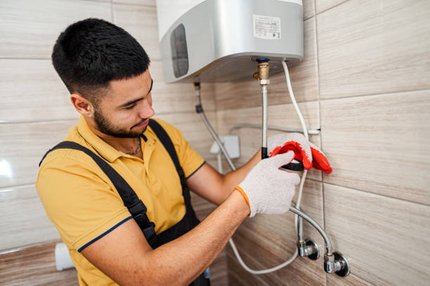 A Plumber Repairing a Water Heater